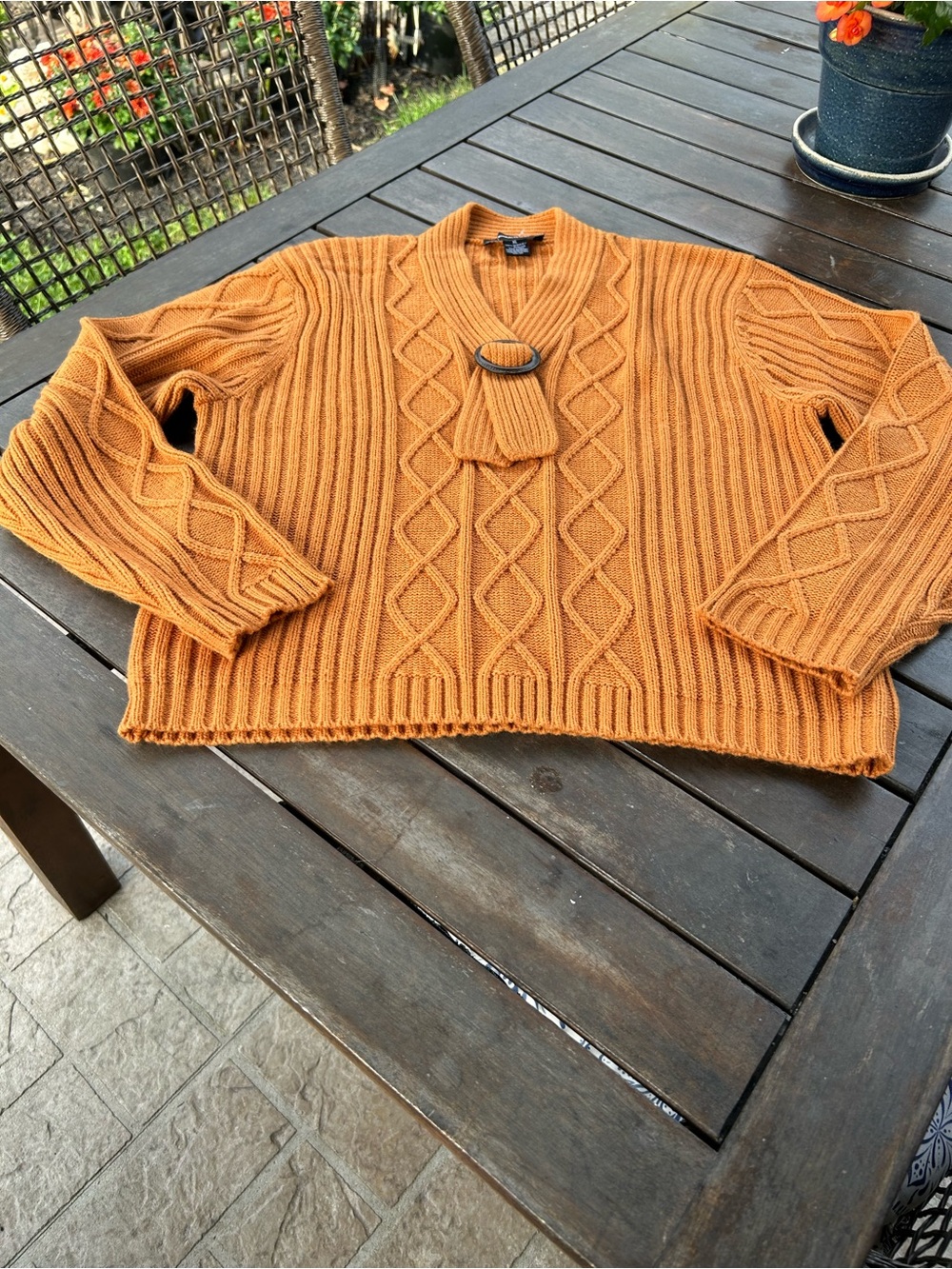New pullover sweater with nice wooden ring embellishing front